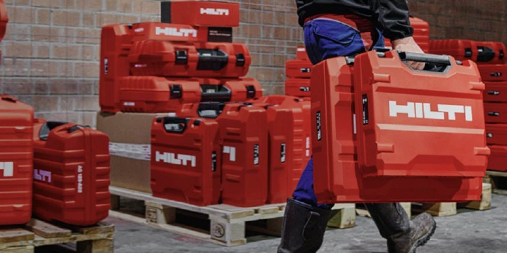 person carrying tool boxes